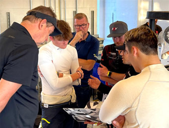 Aidan Kenny in discussion with his team